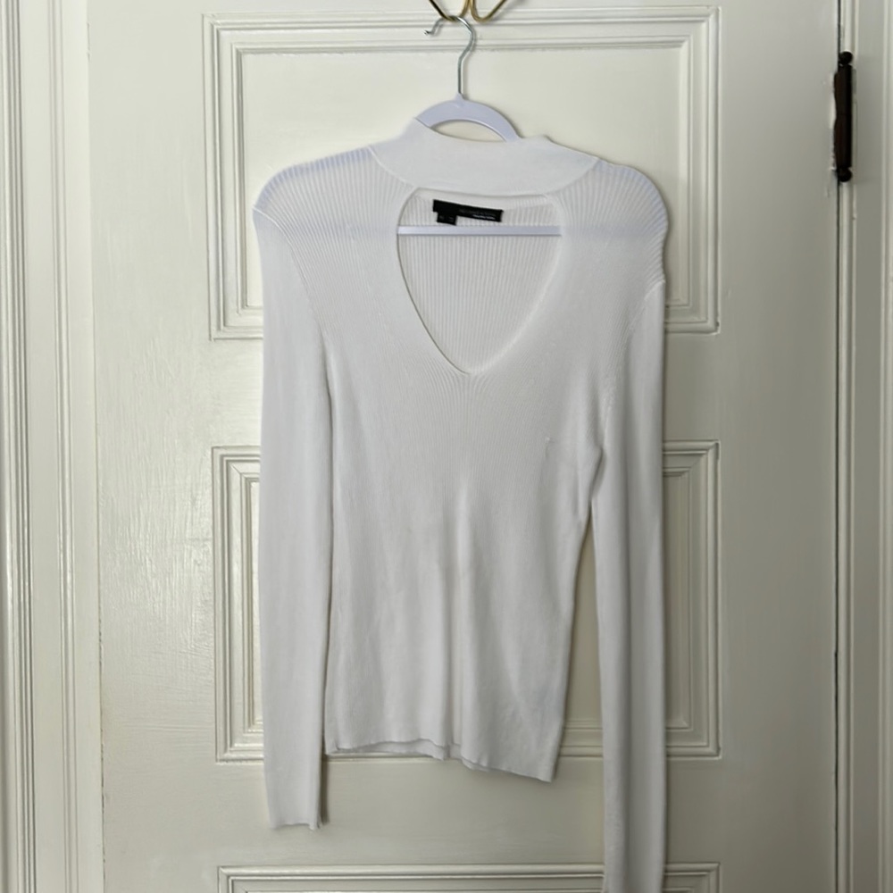 White long sleeve top with open chest detailing